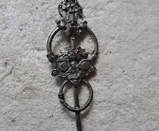St Justin pewter broach.