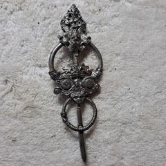 St Justin pewter broach.