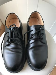 Black Doc Martin shoes.