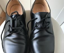Black Doc Martin shoes.
