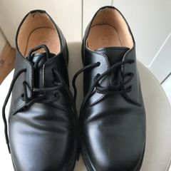 Black Doc Martin shoes.
