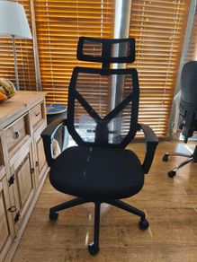 Ergonomic office chair with reclining backrest and adjustable lumbar support