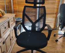 Ergonomic office chair with reclining backrest and adjustable lumbar support