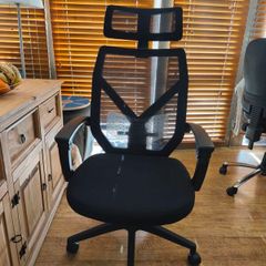 Ergonomic office chair with reclining backrest and adjustable lumbar support