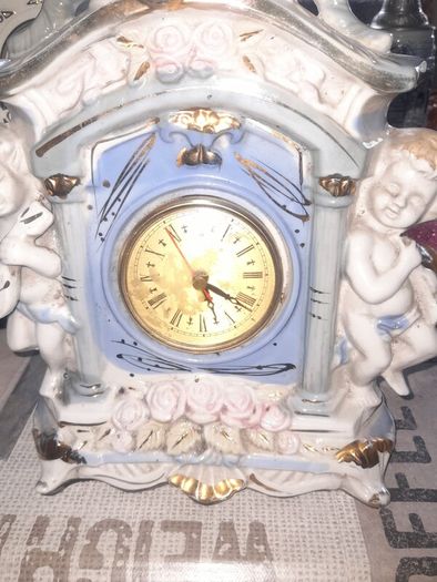 Porcelain Mantel Clock with Two Cherubs and Two Doves on top, and floral accents, Postage Available