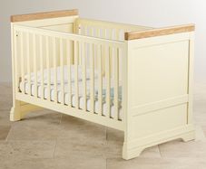 Solid oak adjustable cot bed from Oakfurnitureland.co.uk