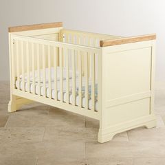Solid oak adjustable cot bed from Oakfurnitureland.co.uk