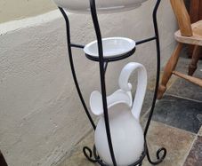 Retro wash stand with bowl, jug, and soap dish.