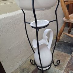 Retro wash stand with bowl, jug, and soap dish.