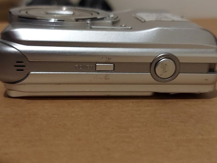 Z880 Digital Camera, Takes 2AA Batteries, working fine, has a modification that doesn't affect its performance