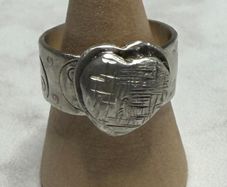 Handmade sterling silver love heart ring with trickles on the wide band. Size R