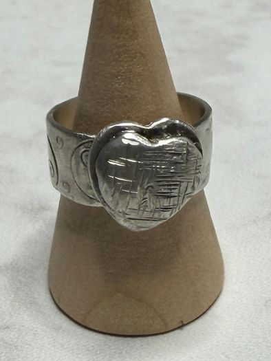 Handmade sterling silver love heart ring with trickles on the wide band. Size R