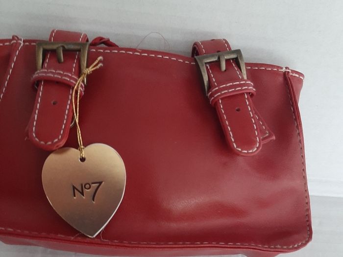 New leather make up bag tag attached
