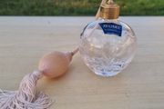 Stuart crystal perfume bottle with atomizer and pink fringe.
