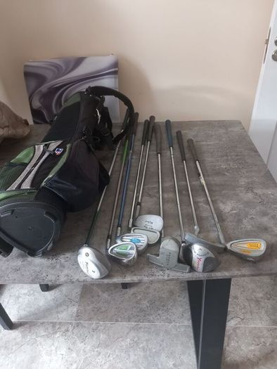 A selection of junior golf clubs and bag.