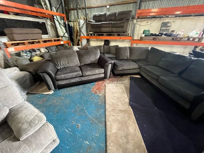 Black corner sofa with matching 2 seater