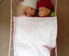 Our Generation Dolls Bundle & Pink Metal Doll Cot with Bedding. Great condition. Christmas is around the corner.