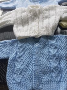 New baby cardigans x6 and 2 hats .Hand knit  .2 blue  1 lemon 2 white 1 green 2 blue hats .Size 0-3 months never worn .25 euro the lot .Collection Dublin 13