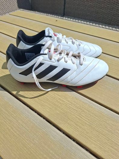 Addidas football boots, shin guards and socks.