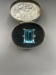 Emerald cut blue topaz ring