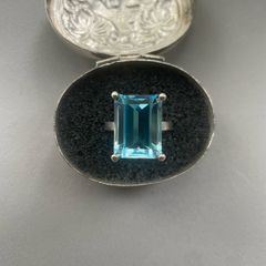 Emerald cut blue topaz ring