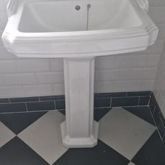 bathroom sink and matching toilet