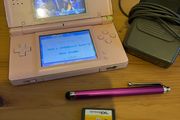 Pink Nintendo DS lite with charger and games