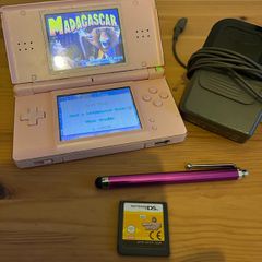 Pink Nintendo DS lite with charger and games