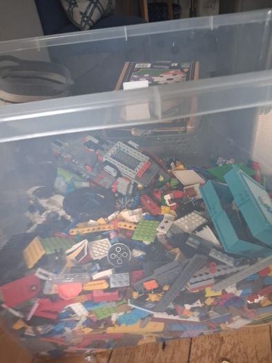 Big box of lego with mini figurines open to offers
