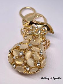 Created White Cats Eye, White Austrian Crystal Vas Keychain In Yellow Gold Tone