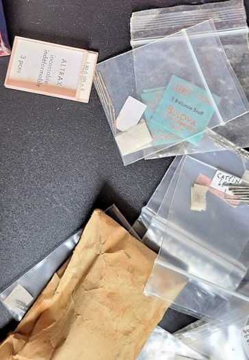 Boxes of miscellaneous watch parts