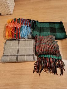 Four women scarves for sale.
