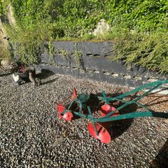 antique plough and turnip presser