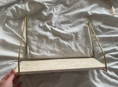 Marble shelf with gold arms