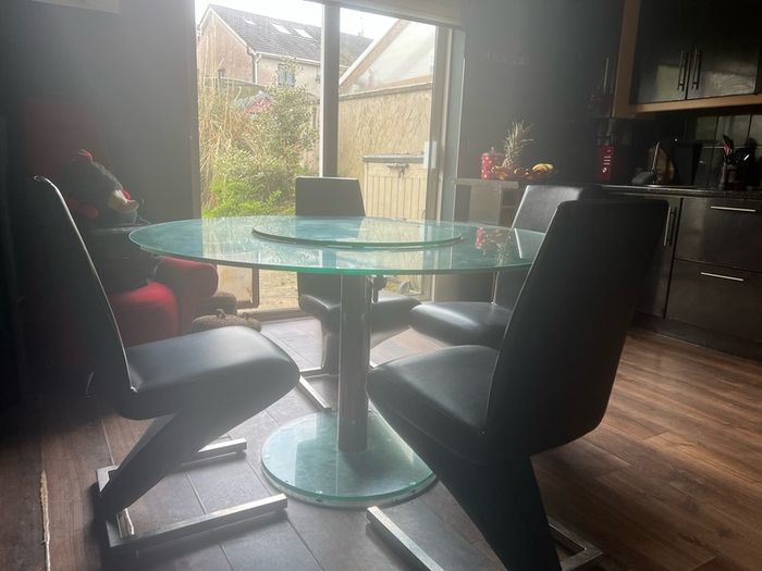 Glass dining table with rotator and 4 leather chairs
