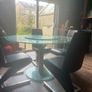 Glass dining table with rotator and 4 leather chairs Image 4