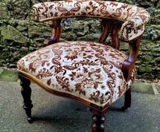 Antique mahogany/damask tub chair