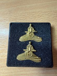 Vintage Irish Defence Forces Artillery Corps collar badges