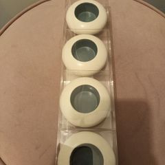 Four ceramic T light holders