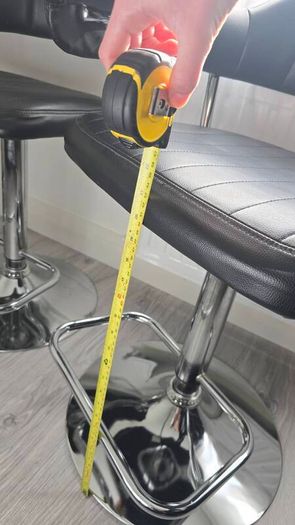 Adjustable black faux leather swivel bar stool with a metal base x3