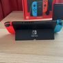 Nintendo Switch OLED (Neon Blue/Red) + Mario Kart 8 Deluxe + Super Mario Bros. W Image 4