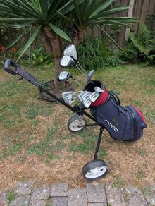 Cheap set of golf clubs and trolley
