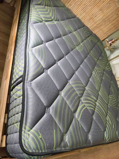 Super King mattress with wooden bed