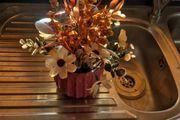 Small orange and tan fake flowers