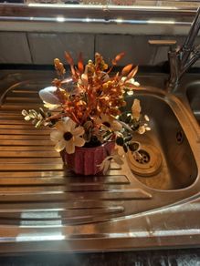 Small orange and tan fake flowers