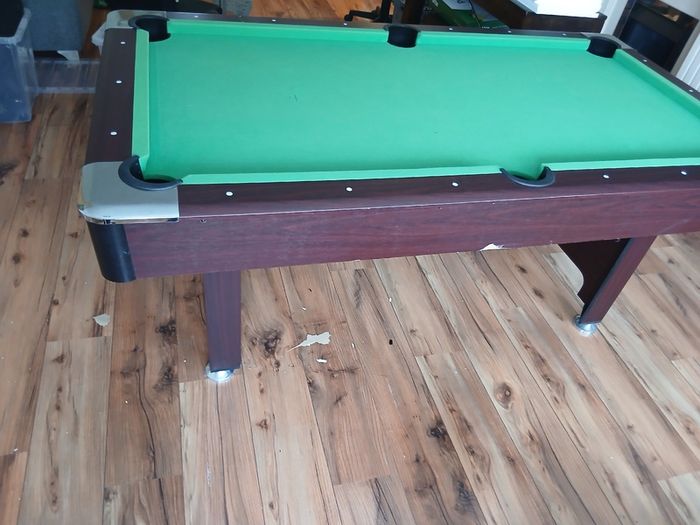 Pool table with cues and balls