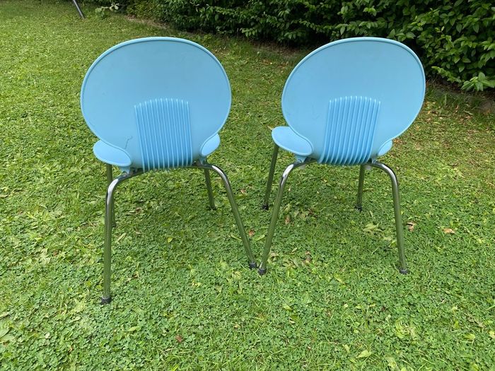 A pair of blue children's chairs
