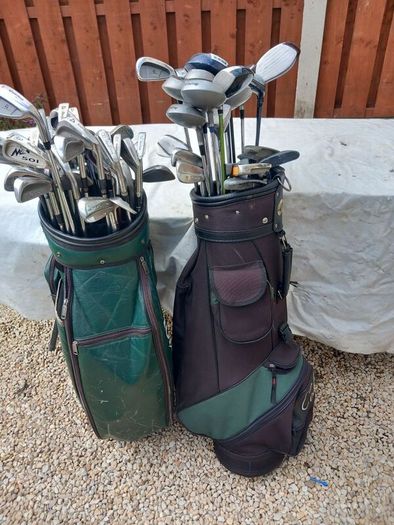 A selection of Golf clubs. Bags and golf balls.