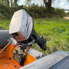 Mariner 30hp outboard or trailer.