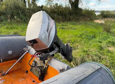 Mariner 30hp outboard or trailer.